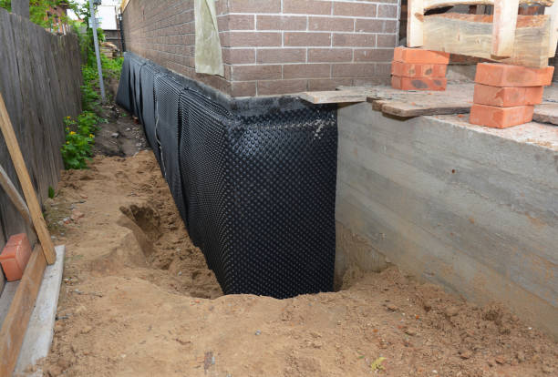 Happy homeowners after waterproofing job in Milltown